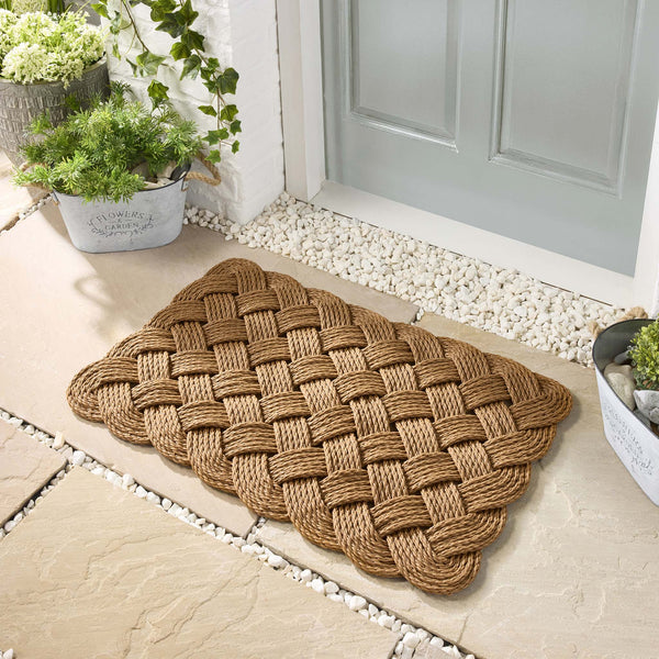 Lovers Knot Beige outdoor mat, knotted polypropylene plastic rope design.