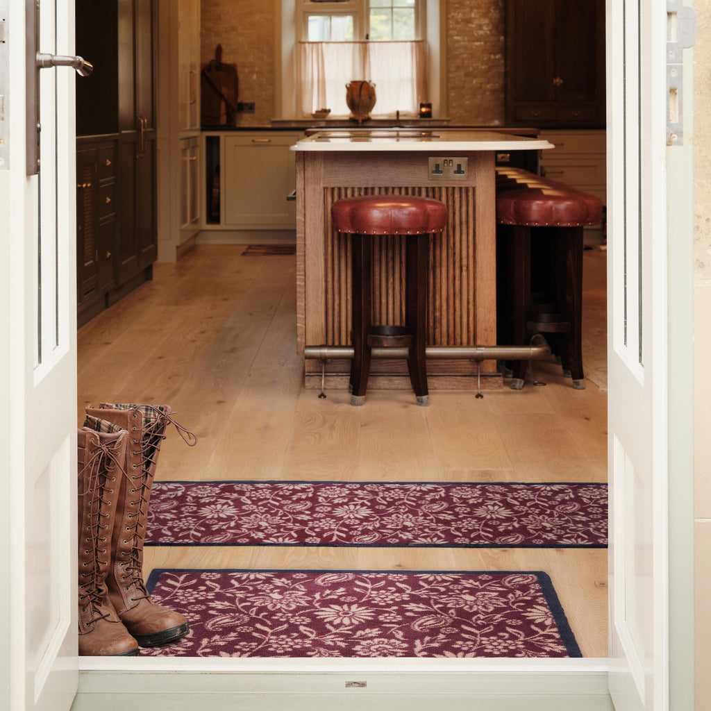 Paisley Floral Burgundy Washable Runner in a dark red- a 100% recycled cotton runner featuring a crisp white floral pattern.