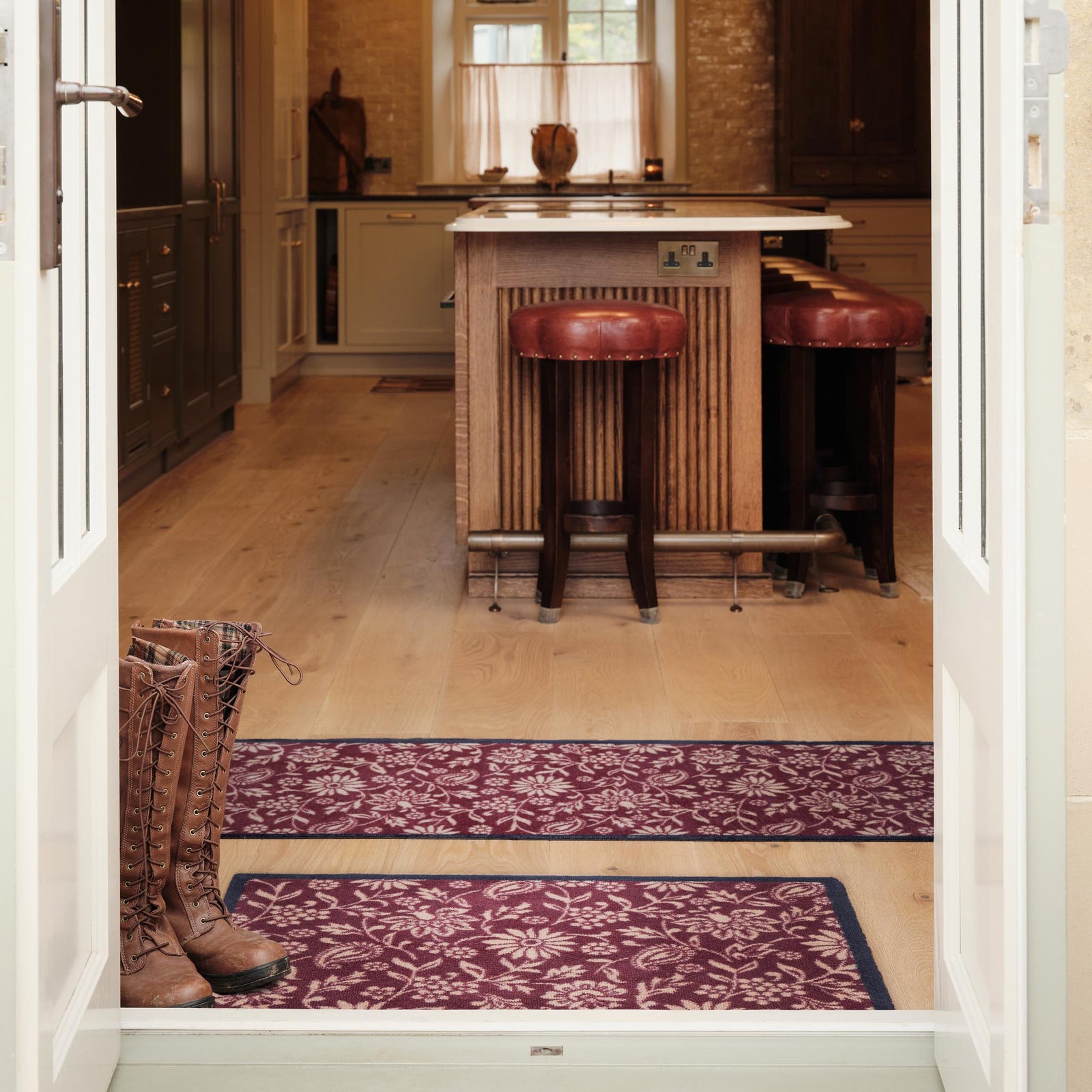 Paisley Floral Burgundy Washable Runner in a dark red- a 100% recycled cotton runner featuring a crisp white floral pattern.