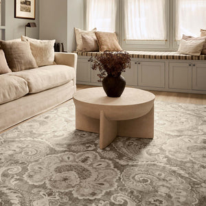 Paisley Tapestry Linen Eco-Washable Rug wiht a paisley design, styled in a living room.