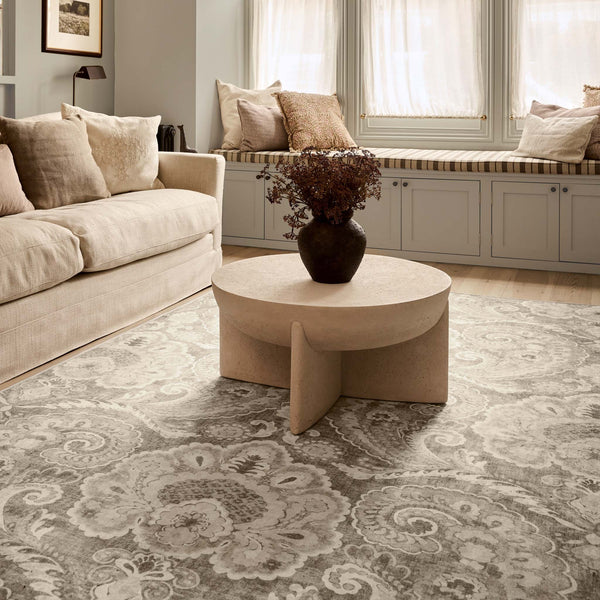 Paisley Tapestry Linen Eco-Washable Rug wiht a paisley design, styled in a living room.