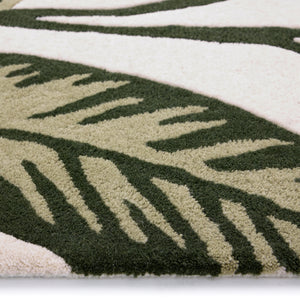 Discover the Paradise Leaf Rug- 100% wool cut pile rug in cream with a leaf design. 