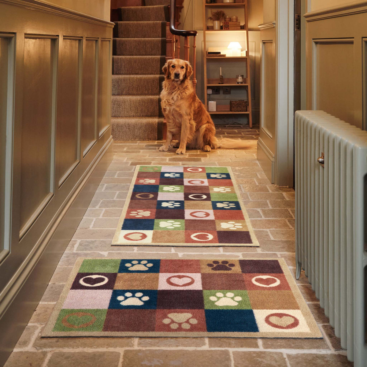 Hug Rug Tartan Paw Green Doormat and Runner with a check pattern with hearts and paw prints, styled in a entryway.