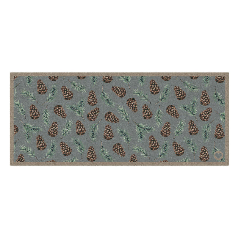 Pinecones Washable runner- 100% recycled cotton runner featuring scattered brown pinecones and green fern leaves.