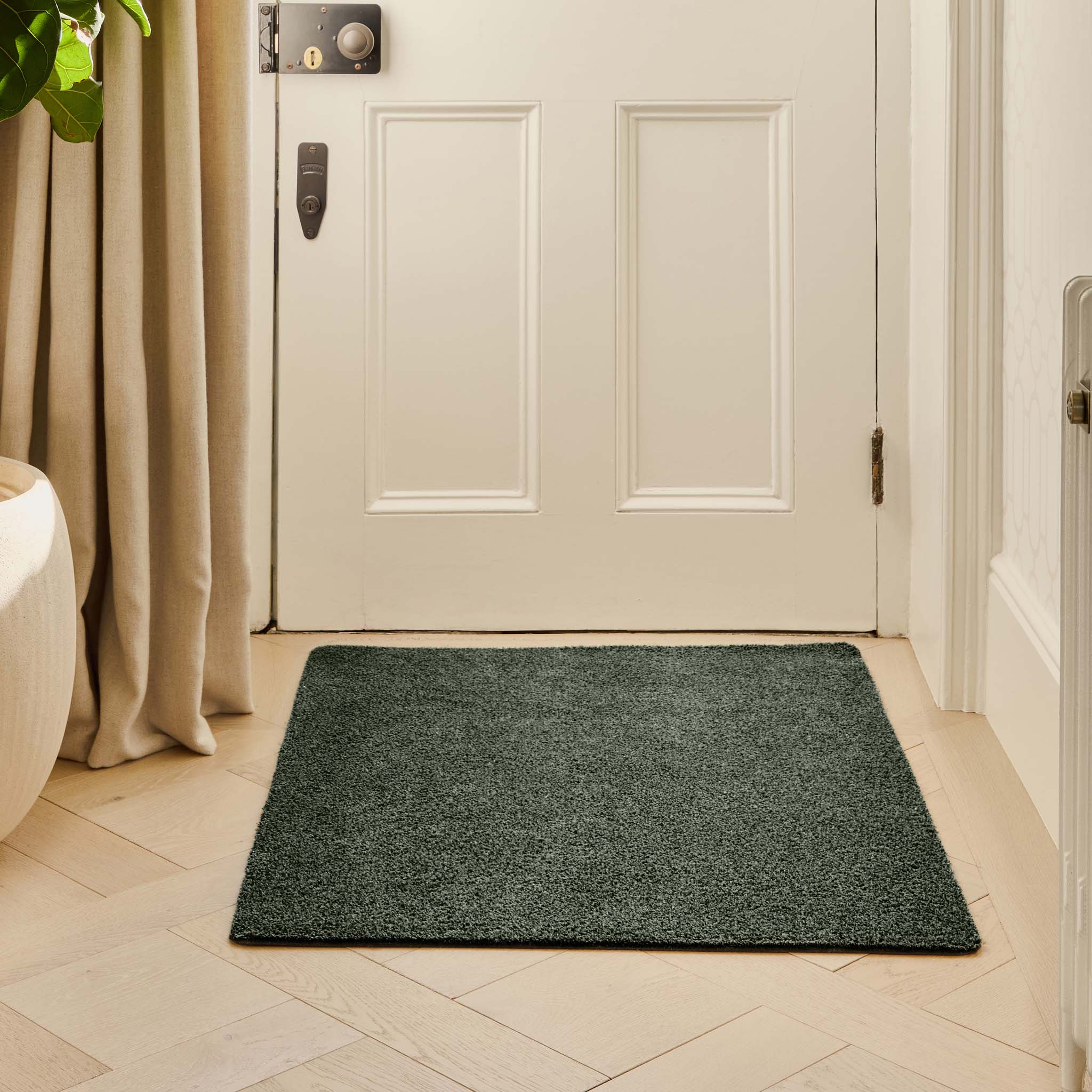 Plain Fleck Sage Green Doormat - a 100% recycled material doormat featuring a green fleck design. 