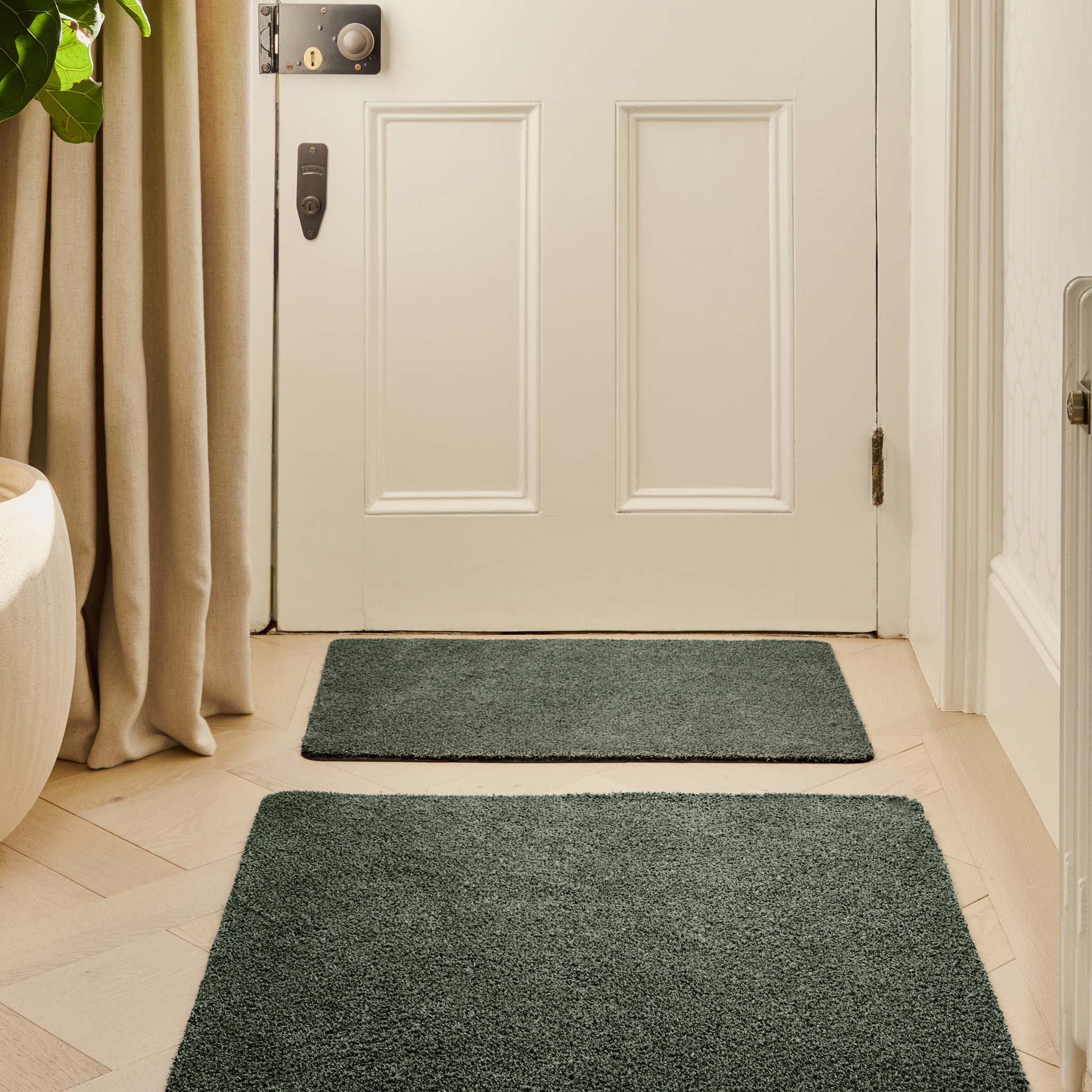 Plain Fleck Sage Green Doormat - a 100% recycled material doormat featuring a green fleck design. 