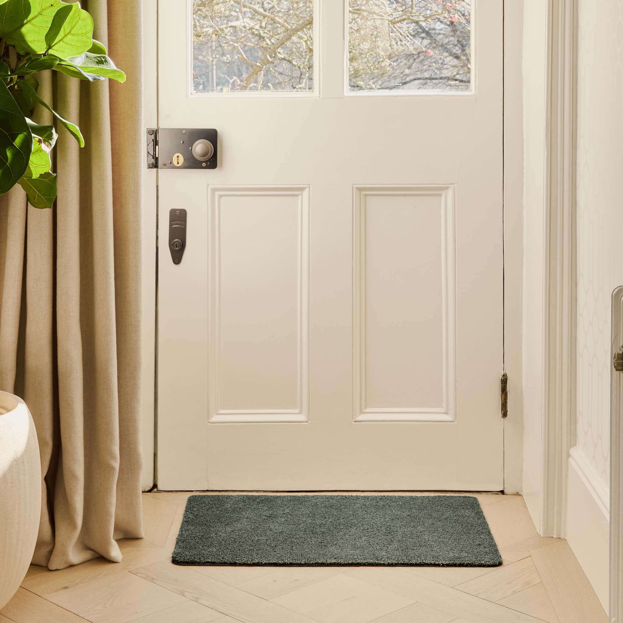 Plain Fleck Sage Green Doormat - a 100% recycled material doormat featuring a green fleck design. 