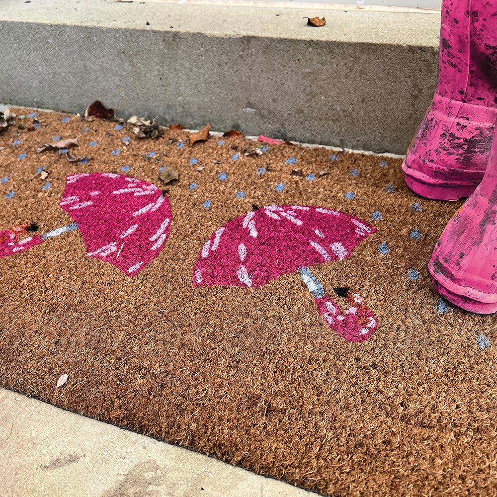 Printed Coir Umbrella Doormat made from natural coconut husk fibres, featuring two pink umbrellas.