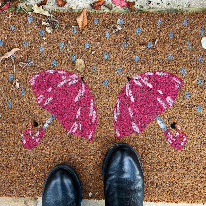 Printed Coir Umbrella Doormat made from natural coconut husk fibres, featuring two pink umbrellas.