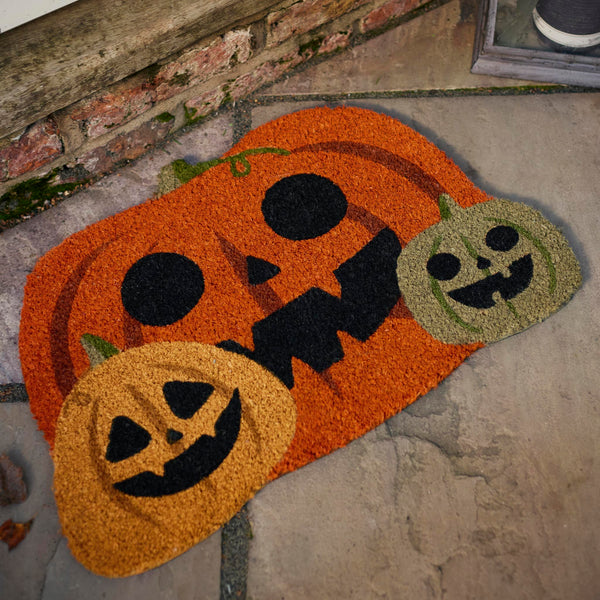 Discover the Pumpkin Halloween Coir Doormat in Orange- a coir doormat with a graphic pumpkin design. 