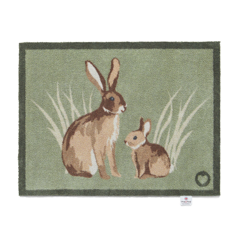 Rabbit 1 Green Washable Doormat made from 100% recycled materials, featuring two rabbits sitting in the green reeds.