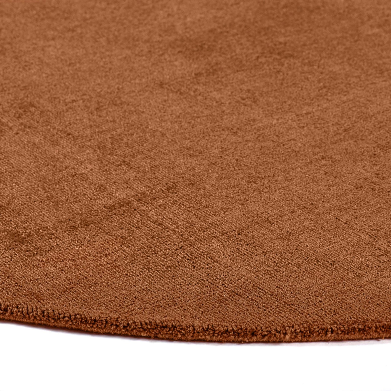 Reef Rust Rug - a 100% recycled material rug featuring an orange/red textured pattern.
