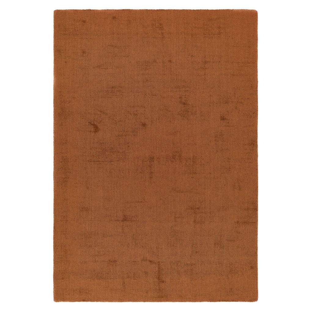Reef Rust Rug - a 100% recycled material rug featuring an orange/red textured pattern.