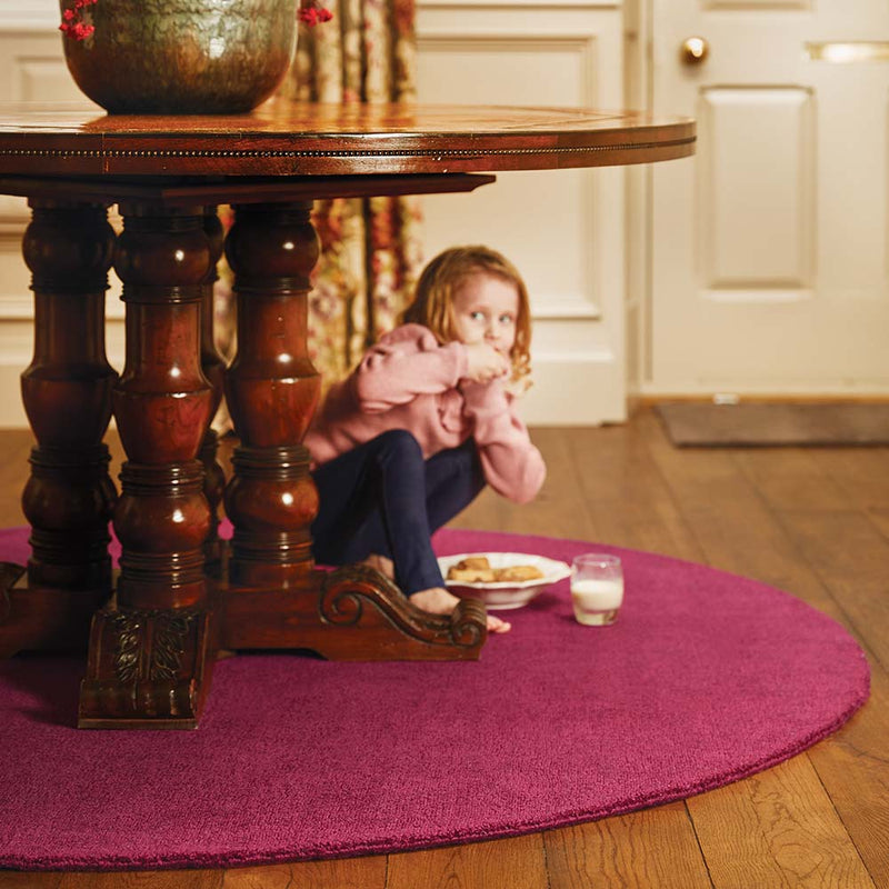 Reef Raspberry Rug made from 100% recycled materials in a solid dark pink colour.