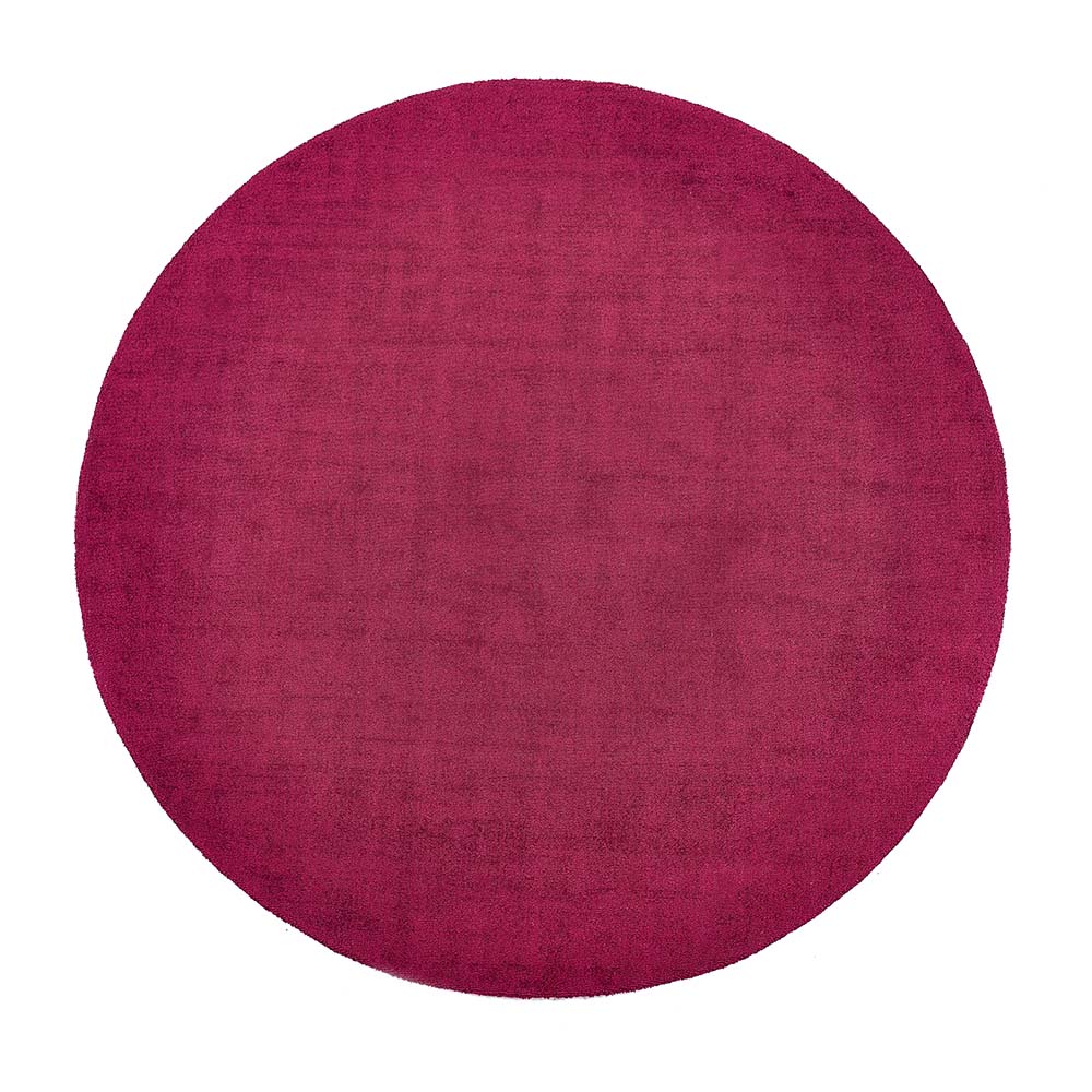 Reef Raspberry Rug made from 100% recycled materials in a solid dark pink colour.