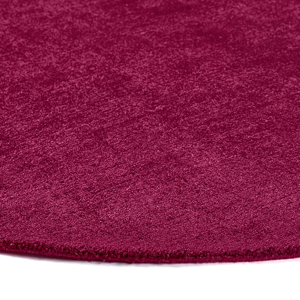 Reef Raspberry Rug made from 100% recycled materials in a solid dark pink colour.