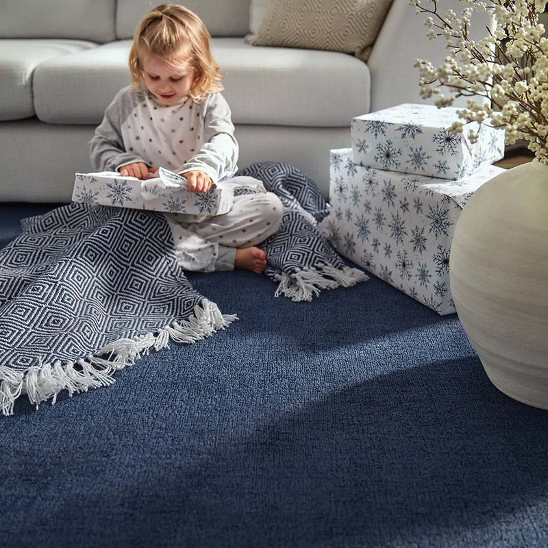 Reef Navy Rug made from 100% recycled materials in a solid dark blue colour.