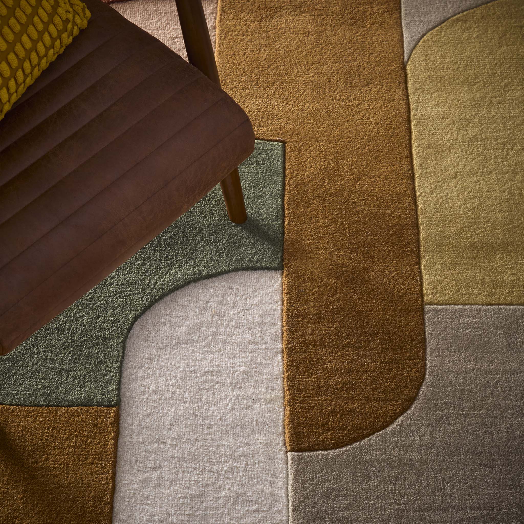 Close-up of Retro Deco Tan Wool Rug showing carved geometic details. 