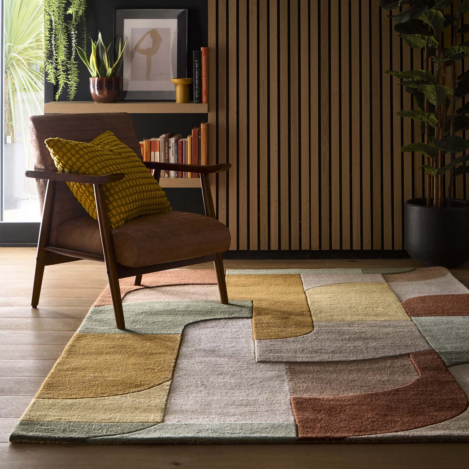 Retro Deco Tan Wool Rug with a carved geometric design, styled on wooden flooring.