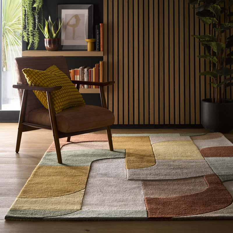 Retro Deco Tan Wool Rug with a carved geometric design, styled on wooden flooring.