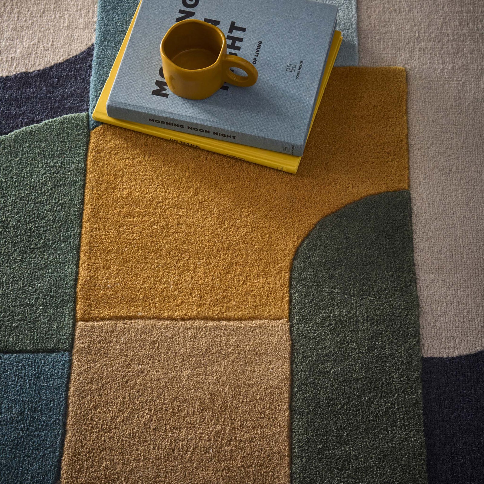 Close-up of Retro Deco Teal Wool Rug with carved geometric shapes.