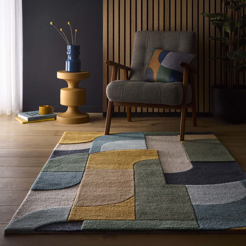 Retro Deco Teal Wool Rug with a carved geometic design, styled on wooden flooring.