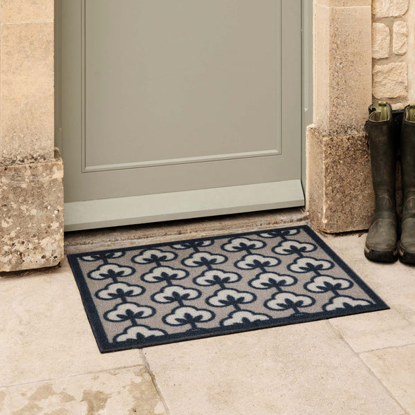 Retro Flower Neutral Outdoor Doormat- made from regenerated nylon featuirng retro flowers.