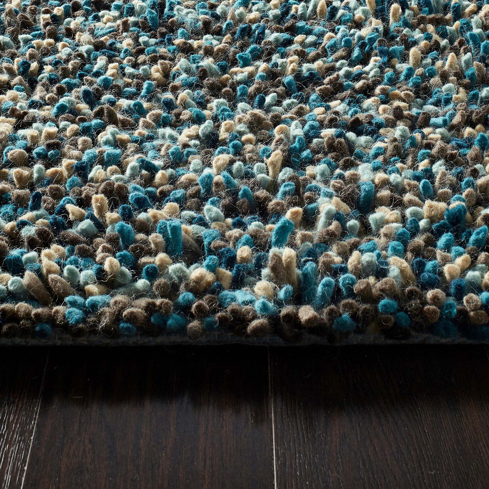 Rocks Shaggy Blue - a 100% wool blue rug featuring a shaggy fleck pattern.