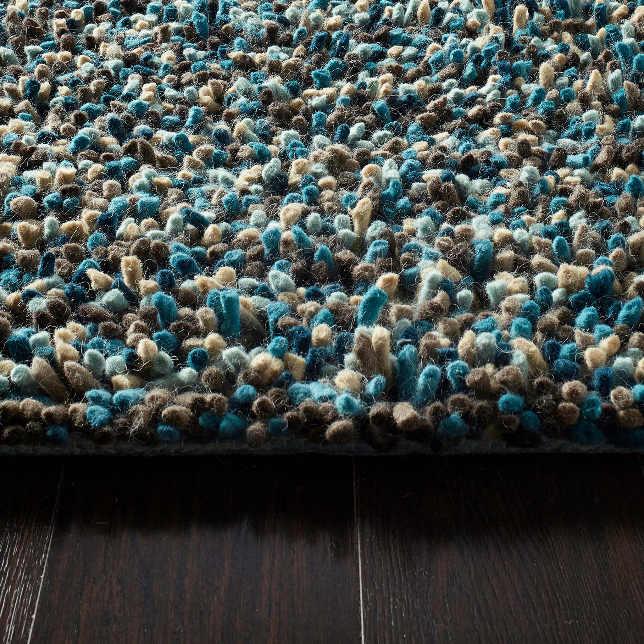Rocks Shaggy Blue - a 100% wool blue rug featuring a shaggy fleck pattern.