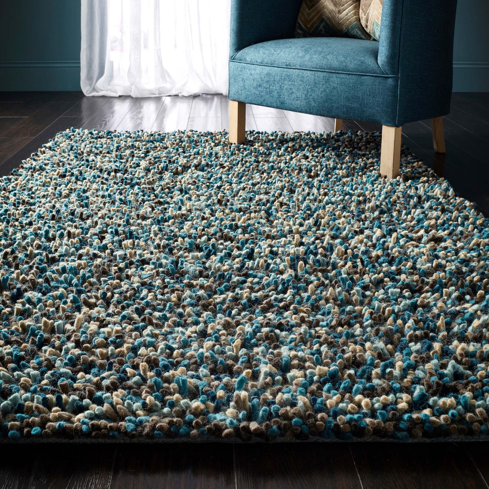 Rocks Shaggy Blue - a 100% wool blue rug featuring a shaggy fleck pattern.