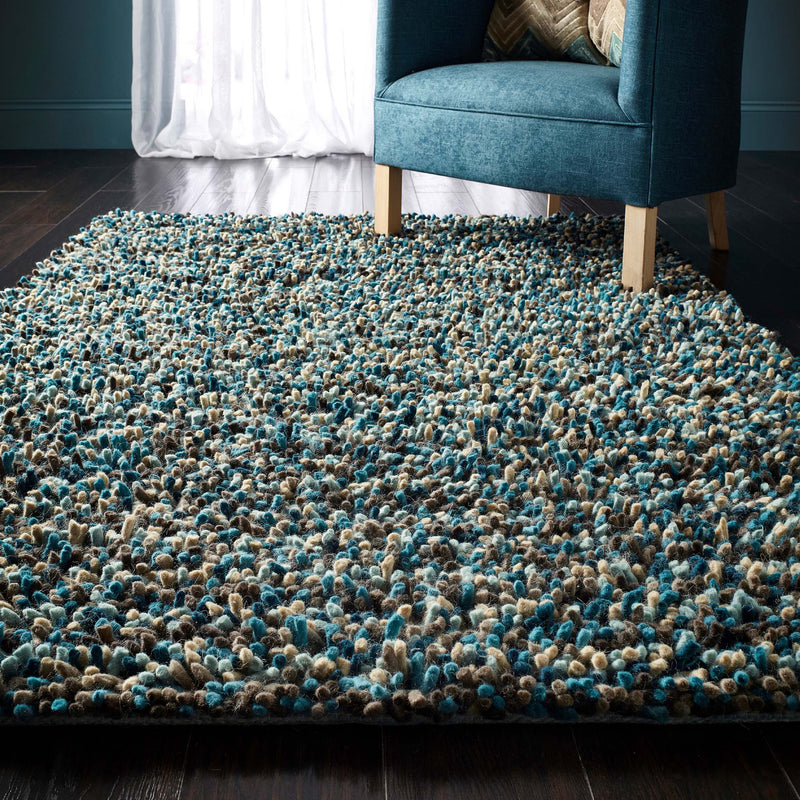 Rocks Shaggy Blue - a 100% wool blue rug featuring a shaggy fleck pattern.