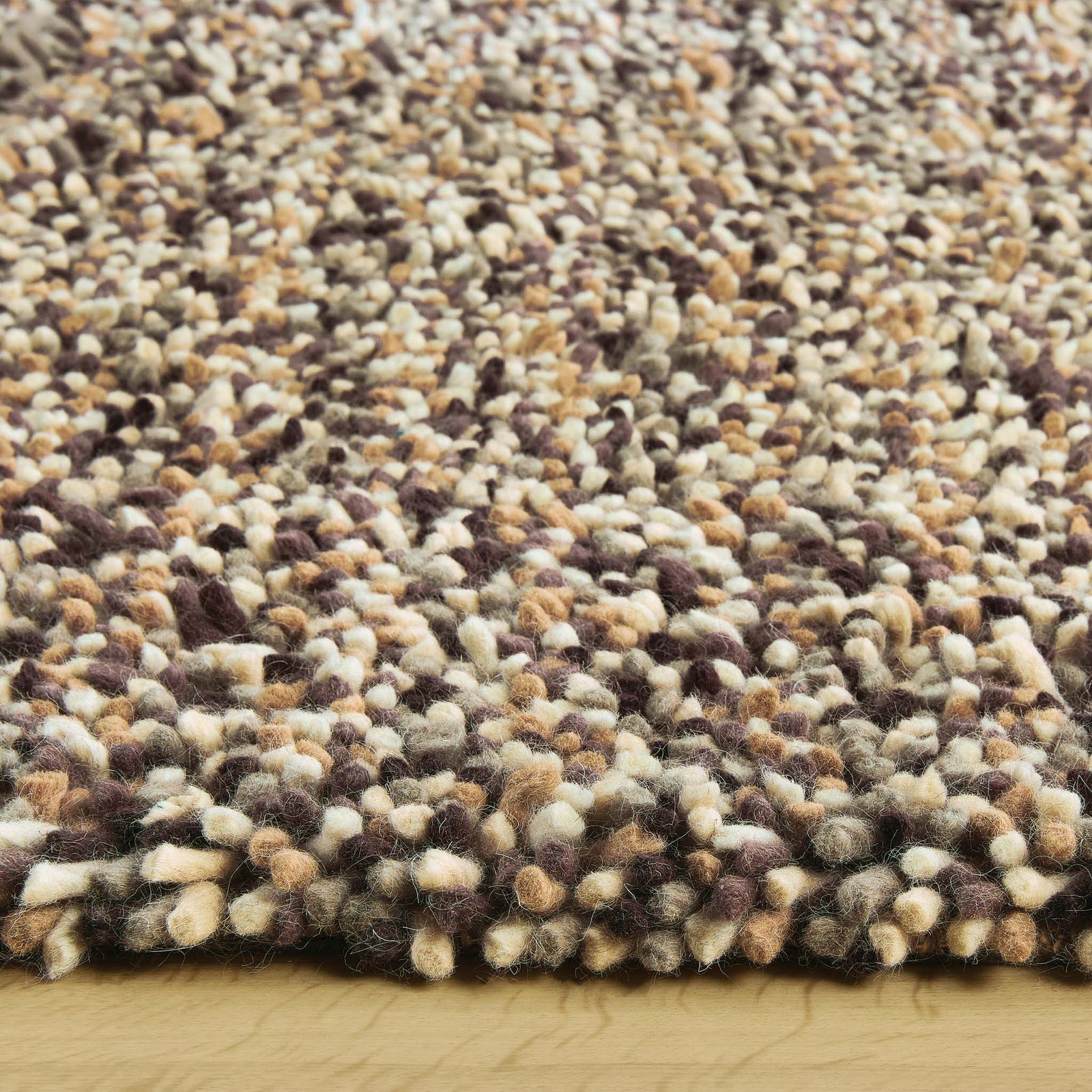 Rocks Shaggy Natural Rug - a 100% wool light brown rug featuring a shaggy fleck pattern.