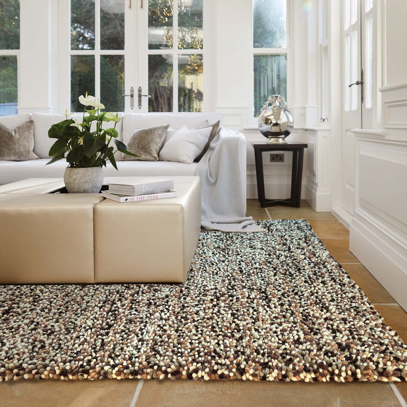 Rocks Shaggy Natural Rug - a 100% wool light brown rug featuring a shaggy fleck pattern.