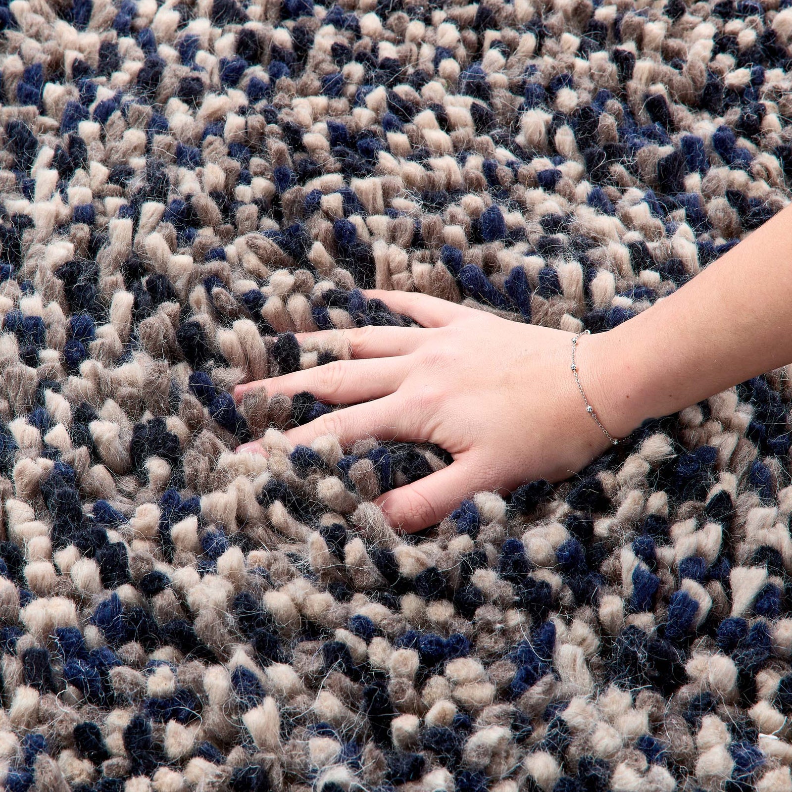 Rocks Shaggy Navy Rug - a 100% wool dark blue rug featuring a shaggy fleck pattern.