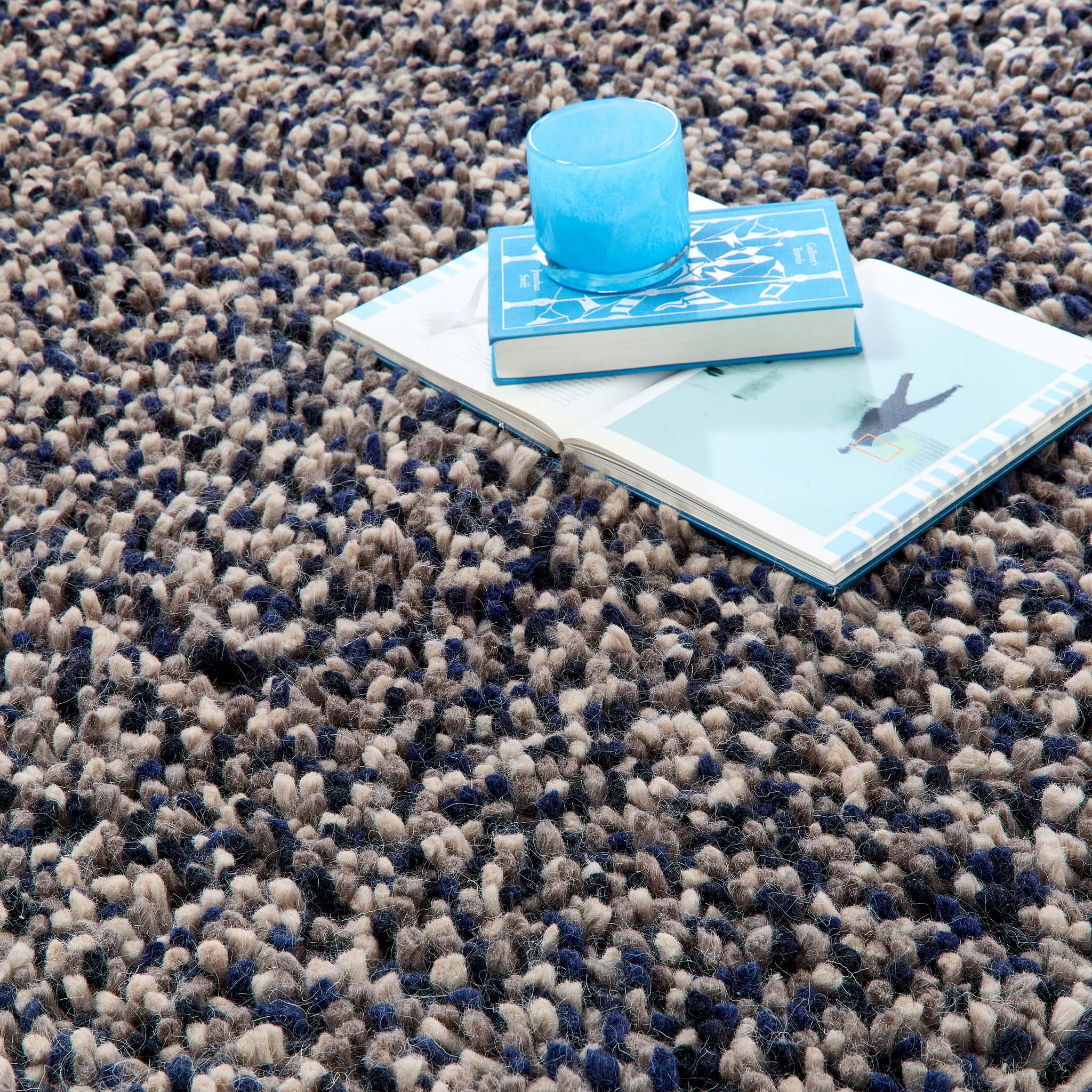 Rocks Shaggy Navy Rug - a 100% wool dark blue rug featuring a shaggy fleck pattern.