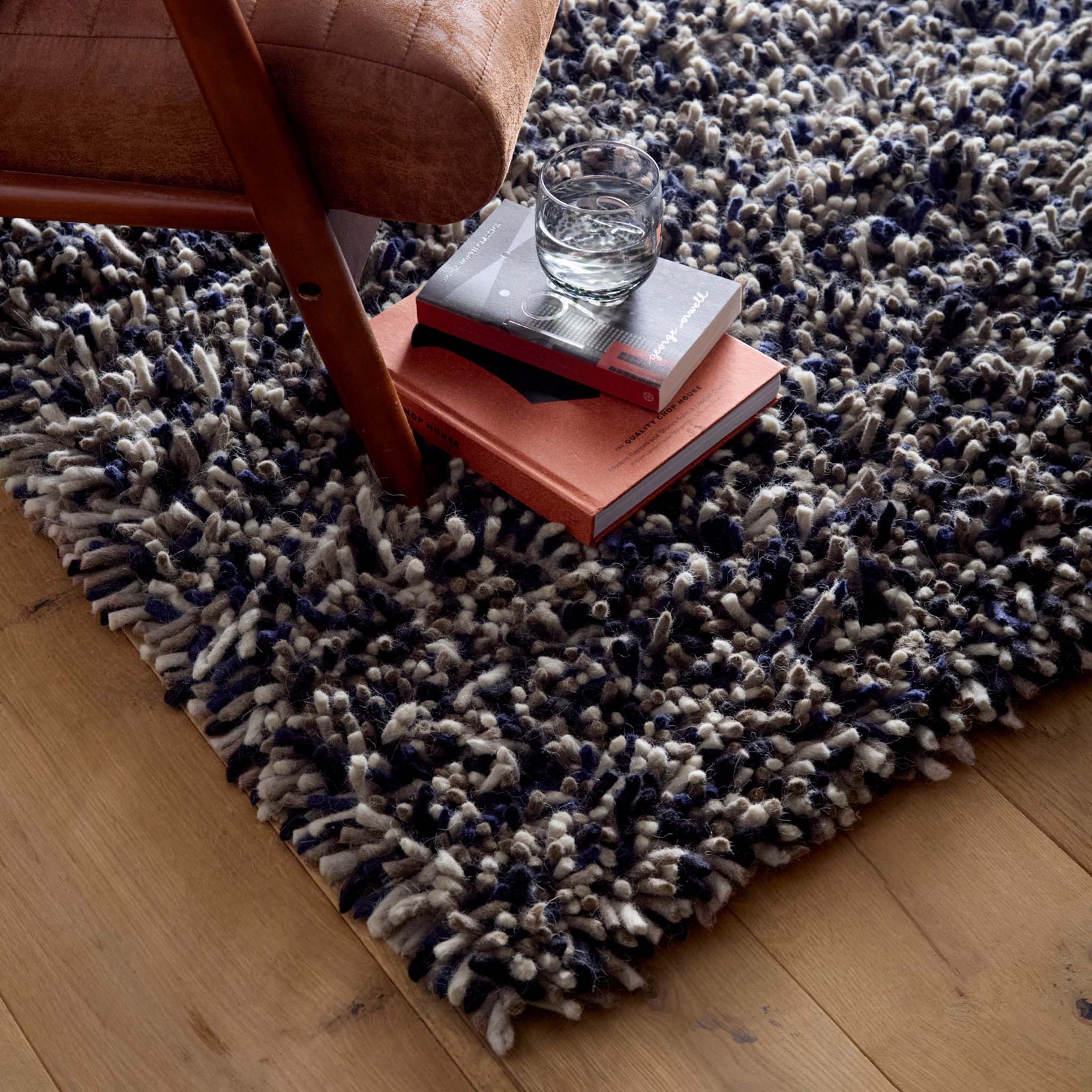 Rocks Shaggy Navy Rug - a 100% wool dark blue rug featuring a shaggy fleck pattern.