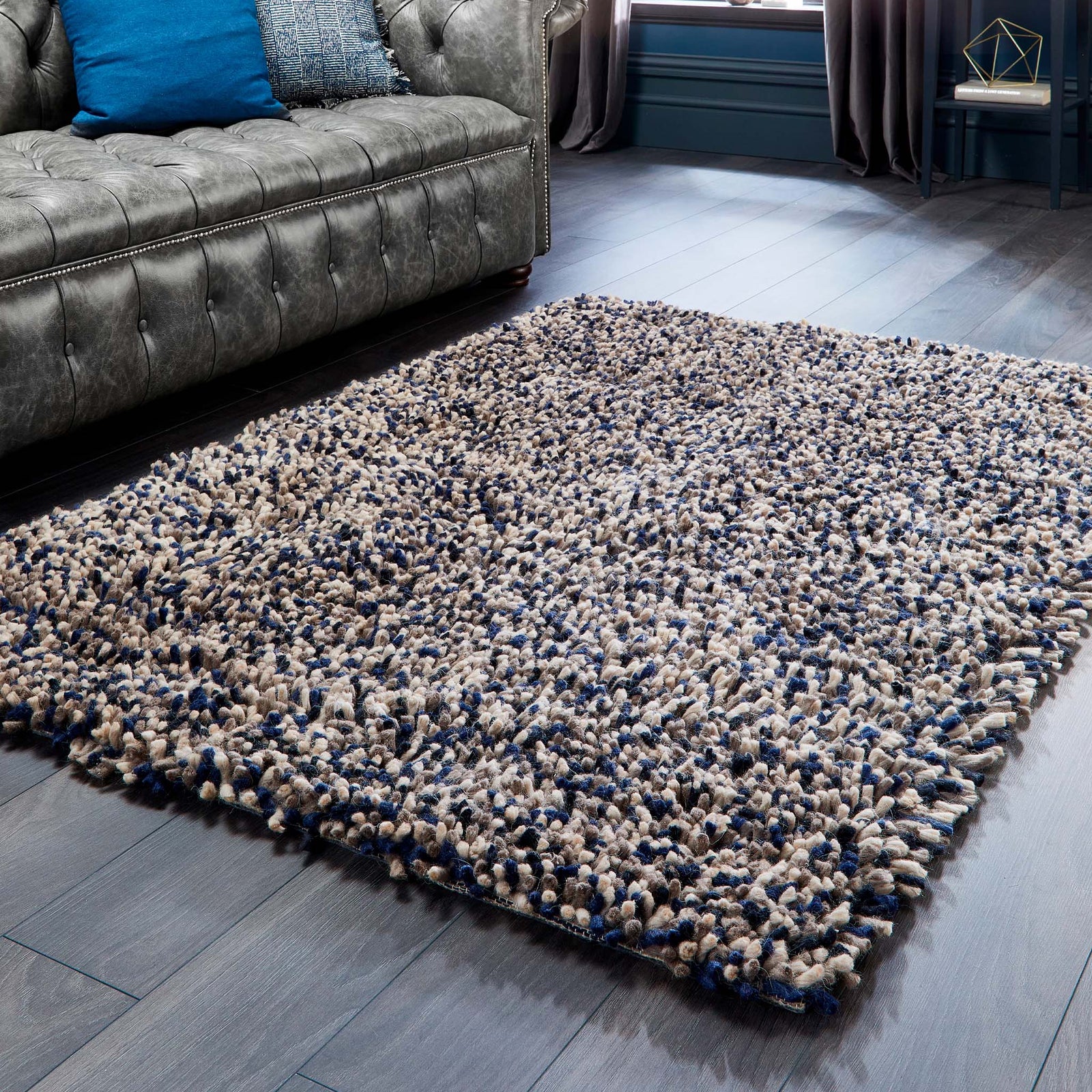 Rocks Shaggy Navy Rug - a 100% wool dark blue rug featuring a shaggy fleck pattern.