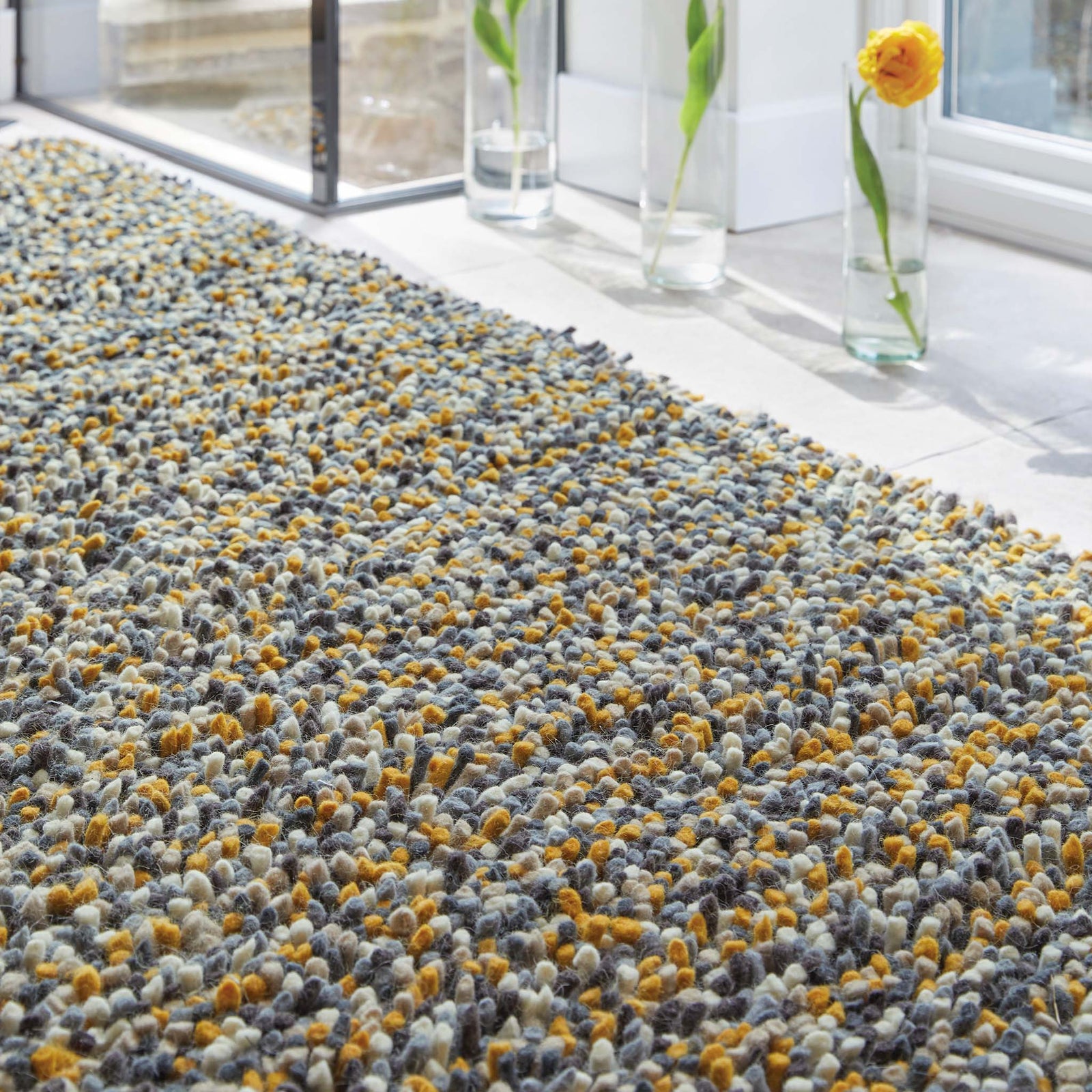 Rocks Shaggy Ochre Rug - a 100% wool yellow rug featuring a shaggy fleck pattern.