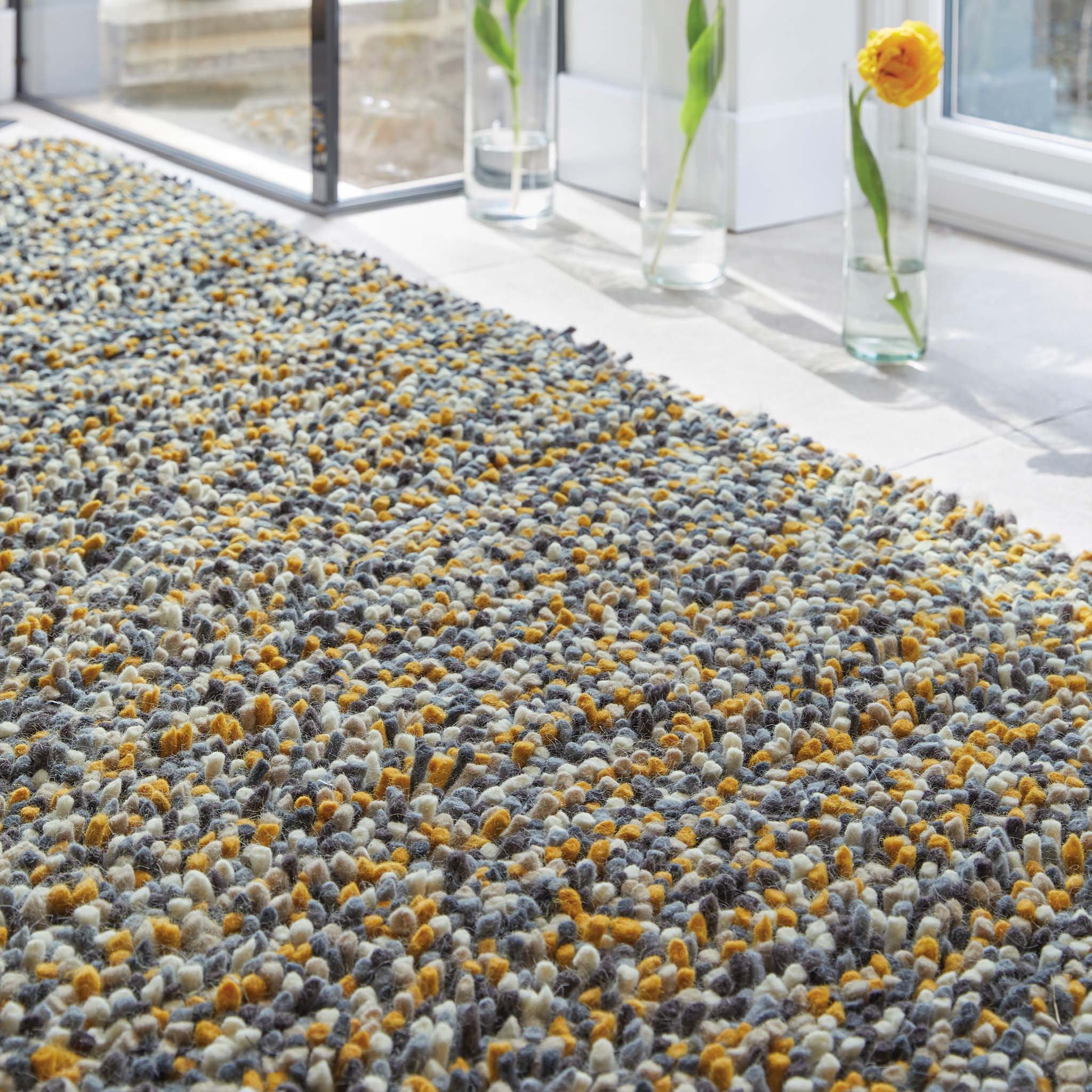 Rocks Shaggy Ochre Rug - a 100% wool yellow rug featuring a shaggy fleck pattern.