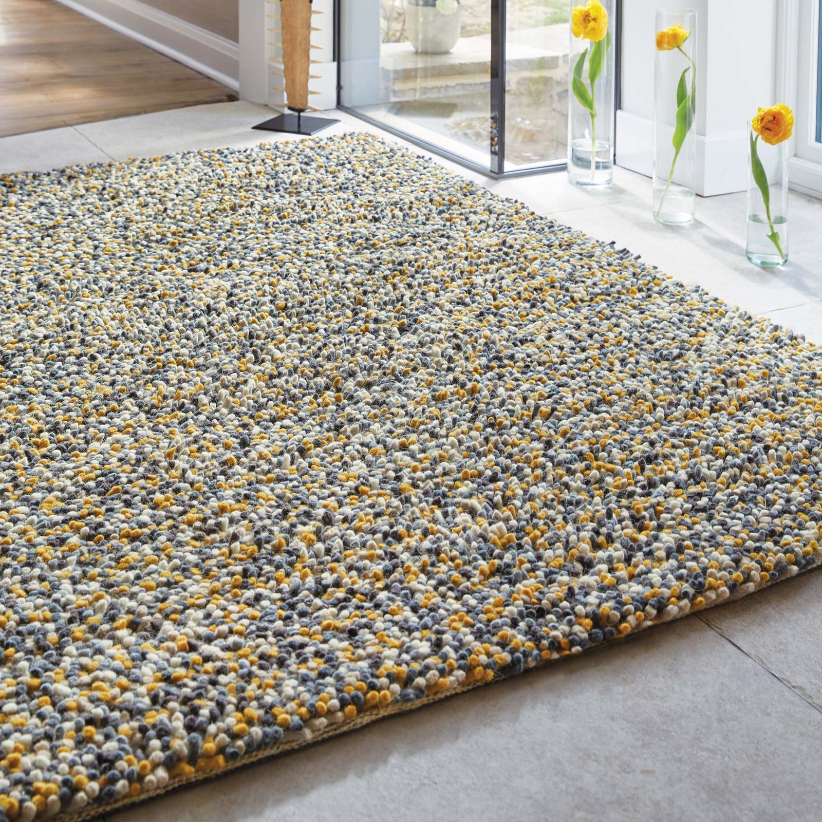 Rocks Shaggy Ochre Rug - a 100% wool yellow rug featuring a shaggy fleck pattern.