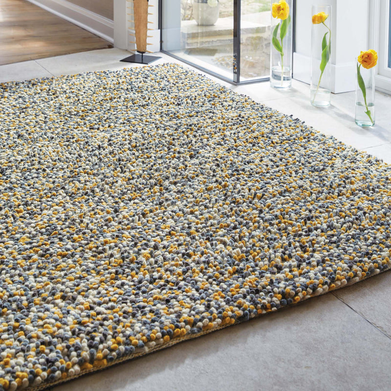 Rocks Shaggy Ochre Rug - a 100% wool yellow rug featuring a shaggy fleck pattern.