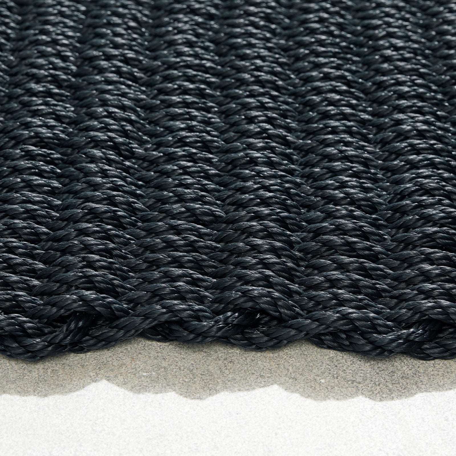Rope Mat Outdoor Black. Made from 100% polypropylene featuring a woven rope design.