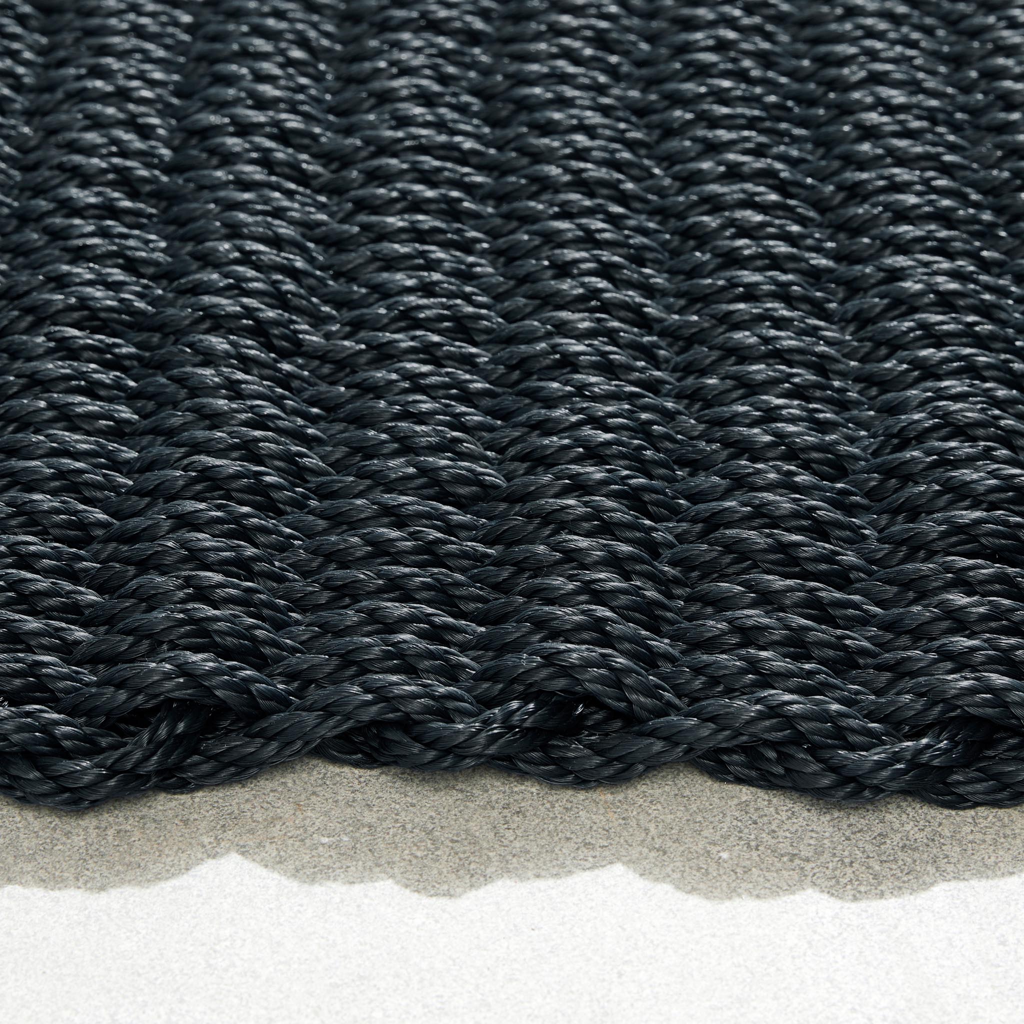 Rope Mat Outdoor Black. Made from 100% polypropylene featuring a woven rope design.