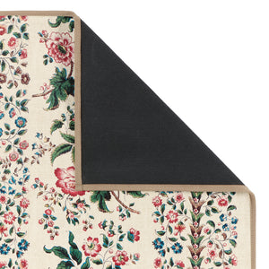 Rose Pergola Chintz Eco-Washable with a floral design showing the rubber backing. 
