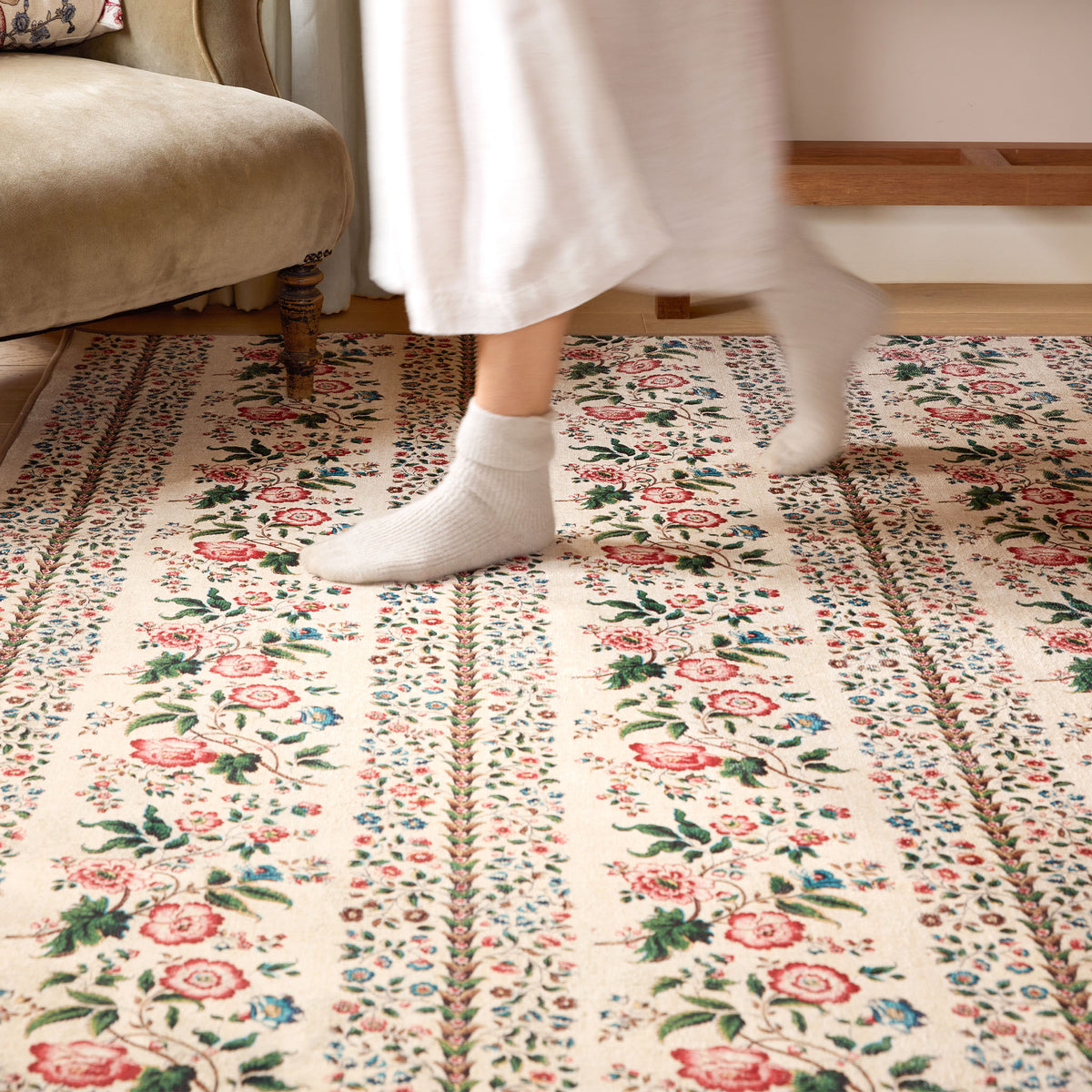 Close-up of Rose Pergola Chintz Eco-Washable Rug with a floral design.