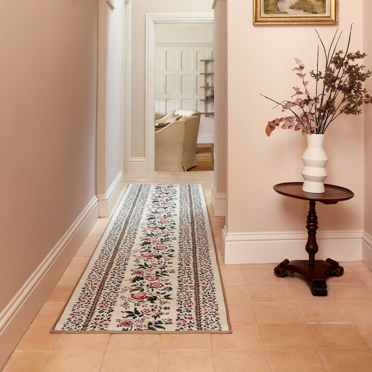Rose Pergola Chintz Eco-Washable Runner with a floral design, styled on wooden flooring. 