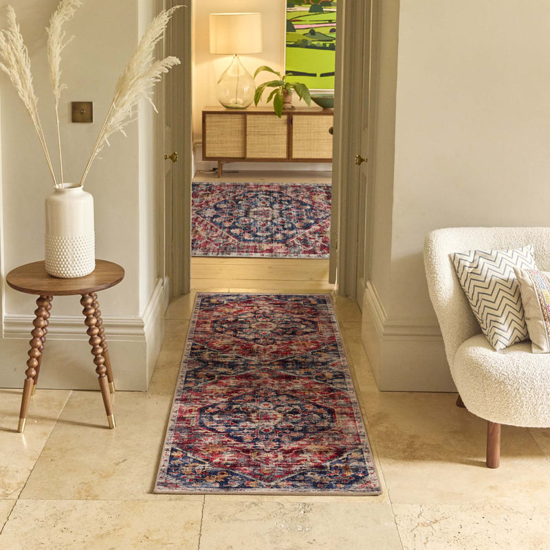 Royal Heritage Eco-Washable Runner and Rug with a red blue abstract pattern, styled in a hallway.