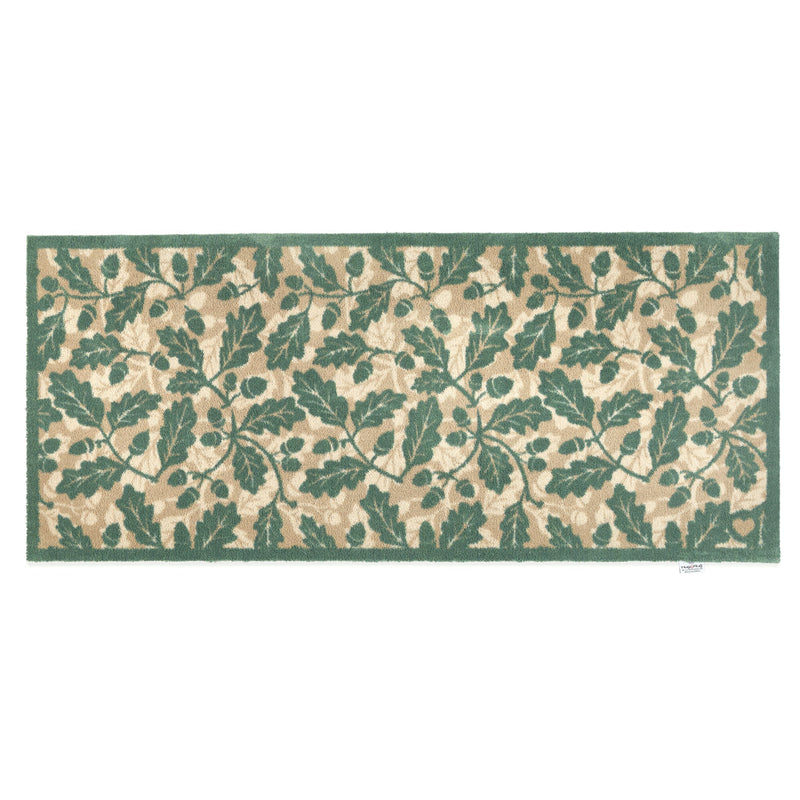 Discover the Royal Oak Washable Runner- a 100% recycled cotton runner featuring pattern of green oak leaves. 