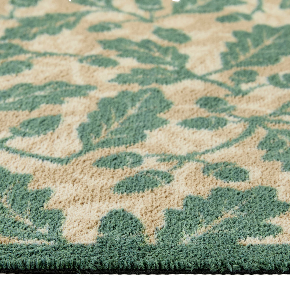 Discover the Royal Oak Washable Runner- a 100% recycled cotton runner featuring pattern of green oak leaves. 