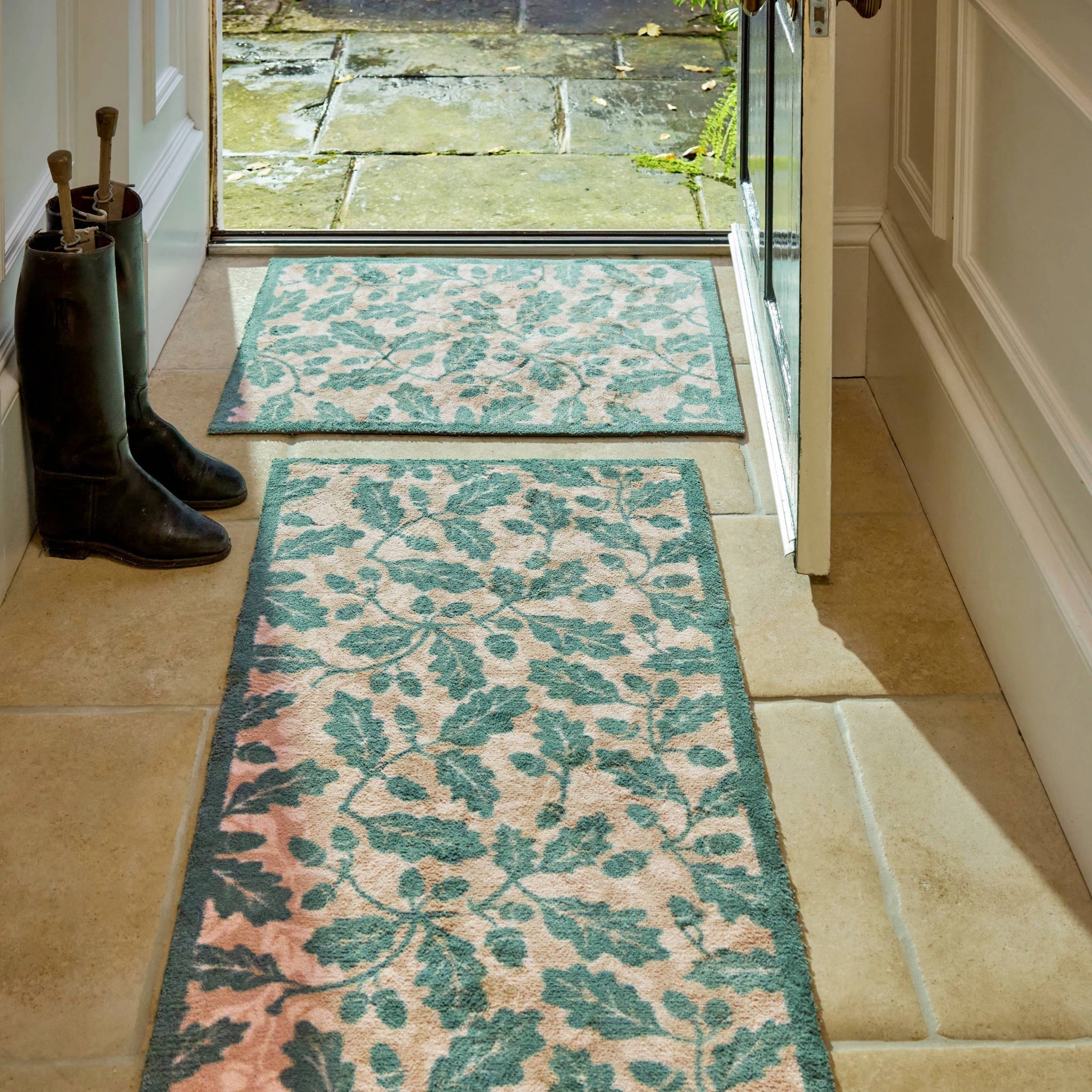 Discover the Royal Oak Washable Runner- a 100% recycled cotton runner featuring pattern of green oak leaves. 